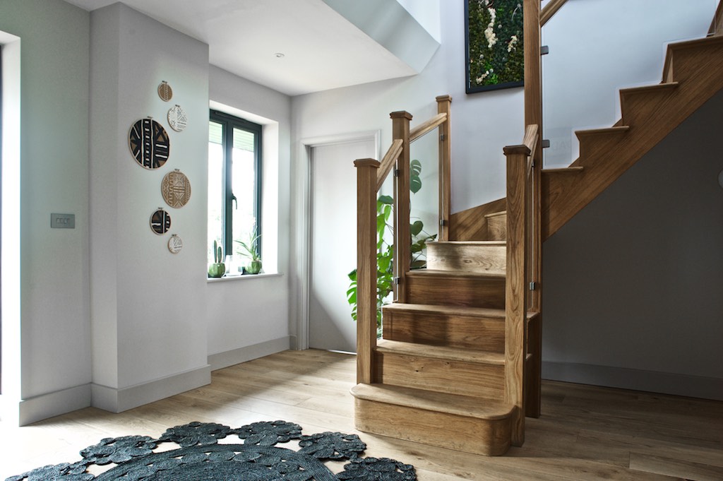 Transformation hallway with oak staircase.